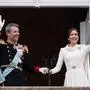 Denmark's King Frederik X and Queen Mary wave to the crowds on the balcony, after the proclamation, at Christiansborg Palace, in Copenhagen, Sunday, Jan. 14, 2024. Denmark’s prime minister proclaimed Frederik X as king after his mother Queen Margrethe II formally signed her abdication. Massive crowds turned out to rejoice in the throne passing from a beloved monarch to her popular son (Bo Amstrup/Ritzau Scanpix via AP)
