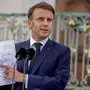 French President Emmanuel Macron shows a map during a press conference at the German government guest house in Meseberg, north of Berlin, Germany, Tuesday, May 28, 2024. (AP Photo/Ebrahim Noroozi)