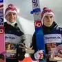 Second placed Norway's Daniel Andre Tande (L) and third placed Norway's Marius Lindvik (R) pose with their trophies after the men's FIS Ski Jumping World Cup in Klingenthal, eastern Germany on December 12, 2021. (Photo by JENS SCHLUETER / AFP)