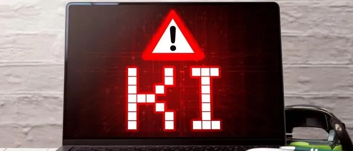 Laptop mit KI-Warnung