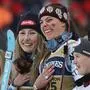 United States' Mikaela Shiffrin, center left, and teammate United States' Breezy Johnson celebrate on the podium after winning the gold medal in a women's team combined event, at the Alpine Ski World Championships, in Saalbach-Hinterglemm, Austria, Tuesday, Feb. 11, 2025. (AP Photo/Marco Trovati)