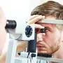 Ophthalmology concept. Male patient under eye vision examination in eyesight ophthalmological correction clinic 