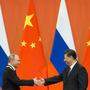 Putin (links) und Xi treffen in Usbekistan aufeinander