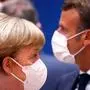 TOPSHOT - Germany's Chancellor Angela Merkel (L) and France's President Emmanuel Macron attends an EU summit at the European Council building in Brussels, on July 18, 2020, as the leaders of the European Union hold their first face-to-face summit over a post-virus economic rescue plan. - The EU has been plunged into a historic economic crunch by the coronavirus crisis, and EU officials have drawn up plans for a huge stimulus package to lead their countries out of lockdown. (Photo by FRANCOIS LENOIR / POOL / AFP)