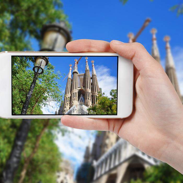 Taking photo of Sagrada Familia with a phone, Barcelona, Spain