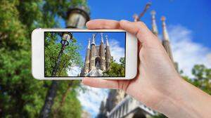 Taking photo of Sagrada Familia with a phone, Barcelona, Spain