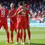 Heidenheim's German forward #10 Tim Kleindienst celebrates his 3-2 with team mates during the German first division Bundesliga football match 1 FC Heidenheim v FC Bayern Munich in Heidenheim, southernwestern Germany on April 6, 2024. (Photo by Thomas KIENZLE / AFP) / DFL REGULATIONS PROHIBIT ANY USE OF PHOTOGRAPHS AS IMAGE SEQUENCES AND/OR QUASI-VIDEO