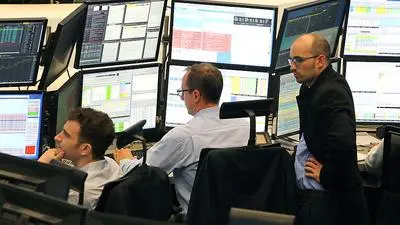 Traders work on April 24, 2017 at the stock exchange in Frankfurt am Main, western Germany.
Germany's blue-chip share index, the DAX, hit an all-time high, as stock markets across Europe reacted with relief to pro-business French presidential candidate Emmanuel Macron's first-round success. / AFP PHOTO / Daniel ROLAND
