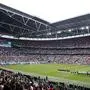 Germany's players, right, stand for the national anthem of their country before the Euro 2020 soccer championship round of 16 match between England and Germany, at Wembley stadium, in London, Tuesday, June 29, 2021. (Matthew Childs/Pool via AP)