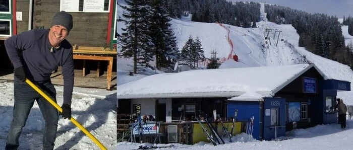 Ein Mann mit einer Schneeschaufel und eine verschneite Almhütte