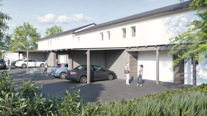 Eine Visualisierung des Projekts. Zu sehen ist eine weiße Reihenhausanlage.