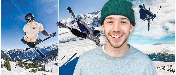 Ein Mann , der mit Skiern in die Luft springt und Kunststücke präsentiert.
