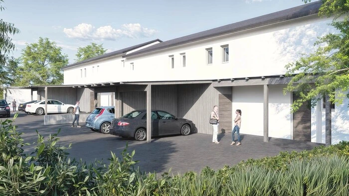 Eine Visualisierung des Projekts. Zu sehen ist eine weiße Reihenhausanlage.