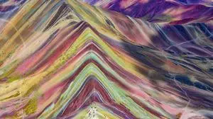 Aerial view of the Rainbow Mountains (Montana de Siete Colores) in Peru with Vinicunca in the center.