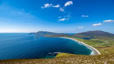 RECORD DATE NOT STATED Beautiful view of turquoise sea and Keel beach in summer on sunny day, Achill Island, Ireland under blue sky *** Sch