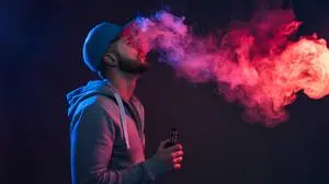 Vaping flavored e-liquid from an electronic cigarette