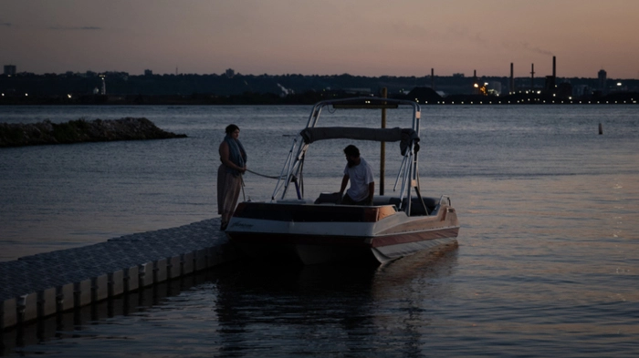 HAMILTON, CANADA - AUGUST 28: Two people pull their boat out of Lake Ontario, on August 28, 2026 in Hamilton, Canada. U.S. President Donald Trump signed an executive order to rename Lake Ontario as "Lake America" amid an ongoing trade war between the U.S. and Canada. Ian Willms/Getty Images/AFP (Photo by Ian Willms / GETTY IMAGES NORTH AMERICA / Getty Images via AFP)