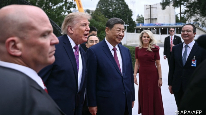 US President Donald Trump speaks briefly with the press (out of frame) as he walks with China's President Xi Jinping after showing him Marine One and the new helipad on the South Lawn of the White House after their bilateral meeting, in Washington, DC, on September 24, 2026. President Xi is on a State visit to the United States from September 23 to 25. (Photo by Brendan SMIALOWSKI / AFP)
