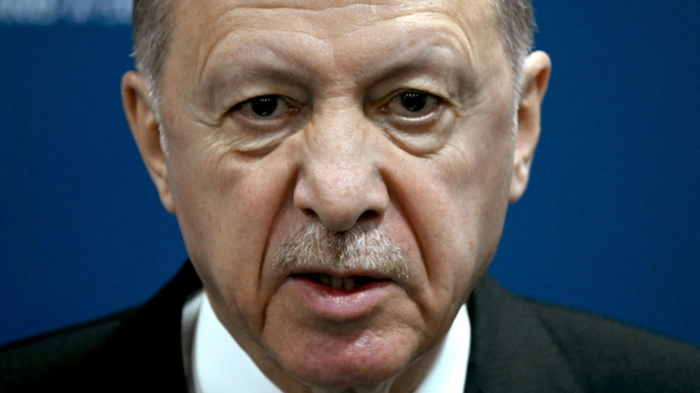 (FILES) Turkey's President Recep Tayyip Erdogan gives a press conference during the G20 Leaders' Meeting in Rio de Janeiro, Brazil, on November 19, 2024. A top adviser to Recep Tayyip Erdogan said the Turkish leader would run again in an early election likely to be held in April 2028, media outlets reported on September 17, 2026. (Photo by Luis ROBAYO / AFP)