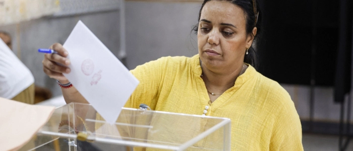 A woman casts her ballot as she votes during Morocco's legislative elections at a polling station inside a school at the Udayas neighborhood in Rabat on September 23, 2026. Moroccans headed to the polls on September 23 to elect a new parliament, with voters focused on the cost of living, employment and inequality while parties stand challenged by distrust. Polling stations opened at 08:00 am (0800 GMT) and were set to close at 07:00 pm, with preliminary results to be announced later at night. (Photo by Abdel Majid BZIOUAT / AFP)