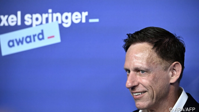German-US entrepreneur, venture capitalist and conservative political activist Peter Thiel arrives on the red carpet for the Axel Springer Award in Berlin on September 24, 2026. (Photo by Tobias SCHWARZ / AFP)