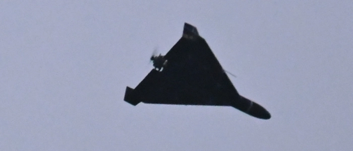 A photograph taken on December 27, 2025 shows an Iranian-designed Shahed 136, (Geranium-2) drone used by Russian Army flying over Kyiv during a Russian drones and missiles attack, amid the Russian invasion in Ukraine. A Russian drone and missile barrage on Kyiv and its suburbs killed one person, wounded two dozen and cut off heating and electricity for hundreds of thousands of people left in freezing temperatures on December 27, 2025. (Photo by Sergei SUPINSKY / AFP)