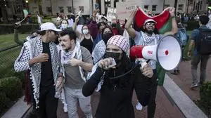 Palestinian supporters demonstrate during a protest at Columbia University, Thursday, Oct. 12, 2023, in New York. Hamas militants launched an unprecedented surprise attack Saturday killing hundreds of Israeli civilians, and kidnapping others. The Israeli military is responding by attacking the Hamas-ruled Gaza Strip with airstrikes. (AP Photo/Yuki Iwamura)