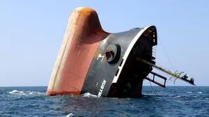 This picture taken on March 7, 2024 shows the Rubymar cargo ship partly submerged off the coast of Yemen. The bulk carrier went down off Yemen after a Huthi missile attack and poses grave environmental risks as thousands of tonnes of fertiliser threaten to spill into the Red Sea, officials and experts warn. The Belize-flagged, Lebanese-operated Rubymar sank on Saturday with 21,000 metric tonnes of ammonium phosphate sulfate fertiliser on board, according to US Central Command. (Photo by Khaled Ziad / AFP)