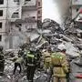 This photo released by Belgorod regional governor Vyacheslav Gladkov's Telegram channel on Sunday, May 12, 2024, Russian emergency service employees work at the scene of a partially collapsed block of flats after a missile attack by the Ukrainian Armed Forces in the Russian city of Belgorod, Russia. In a statement, Russia's Investigative Committee, the country's top law enforcement agency, said that the 10-story block had been hit by Ukrainian shelling. (Belgorod Region Governor Vyacheslav Gladkov Telegram channel via AP)
