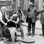New York City Deputy Police Commissioner John A. Leach, watching agents pour liquor into sewer following a raid during the height of prohibition, c.1921 b/w photo 1127461 New York City Deputy Police Commissioner John A. Leach, watching agents pour liquor into sewer following a raid during the height of prohibition, c.1921 b/w photo by American Photographer, 20th century Private Collection. Copyright: xBridgemanxImagesx 1127461