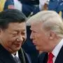 FILE - President Donald Trump, right, talks with China's President Xi Jinping during a welcome ceremony at the Great Hall of the People in Beijing, Nov. 9, 2017. (AP Photo/Andy Wong, File)