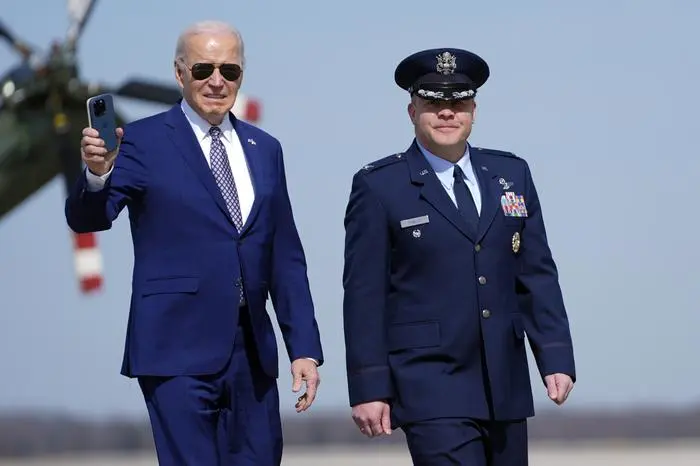 President Joe Biden walks to board Air Force One with Col. Paul Pawluk, Vice Commander, 89th Airlift Wing, at Andrews Air Force Base, Md., for a trip to New York, Monday, Feb. 26, 2024. (AP Photo/Evan Vucci)