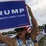 A supporter of former US President and Republican presidential candidate Donald Trump holds a placard and chants slogans near his residence at Mar-a-Lago as they react after he was convicted in his criminal trial, in Palm Beach, Florida, on May 30, 2024. A panel of 12 New Yorkers were unanimous in their determination that Donald Trump is guilty as charged -- but for the impact on his election prospects, the jury is still out. The Republican billionaire was convicted of all 34 charges in New York on May 30, 2024, and now finds himself bidding for a second presidential term unsure if he'll be spending 2025 in the Oval Office, on probation or in jail. (Photo by Chandan KHANNA / AFP)