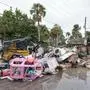 Salvage works remove debris from Hurricane Helene flooding along the Gulf of Mexico before approaching Milton, Monday, Oct. 7, 2024, in Clearwater Beach, Fla. (AP Photo/Chris O'Meara)