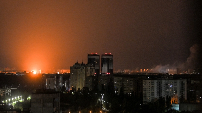 This photograph shows an explosion during a Russian missile strike on the Ukrainian capital of Kyiv on July 6, 2026, amid the Russian invasion in Ukraine. Russia struck Ukraine's Kyiv region with ballistic missiles on July 6, killing at least eight people and wounding dozens, authorities said, on the eve of a NATO summit in Turkey. (Photo by Eugene KOTENKO / AFP)