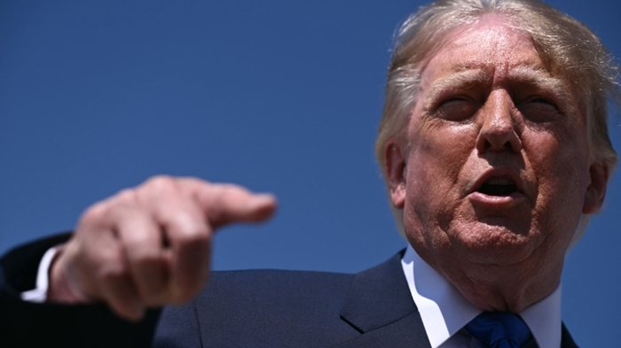 US President Donald Trump speaks to reporters before boarding Air Force One at Joint Base Andrews in Maryland on September 9, 2026. Trump is traveling to Dallas, Texas, to address the first-ever Republican National Committee (RNC) midterm convention. (Photo by Brendan SMIALOWSKI / AFP)