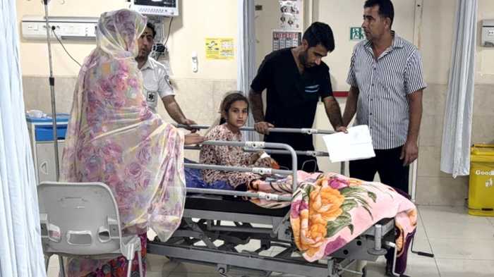 EDITORS NOTE: Graphic content / In this picture obtained by AFP from the Iranian news agency Tasnim on September 2, 2026 a child sits on a hospital bed at a trauma ward following injuries from an overnight strike in Kuhestak, Sirik County, in Iran's southern Hormozgan province on September 2, 2026. Iranian forces said on September 2 that they launched attacks on US military targets in the United Arab Emirates, Kuwait, Bahrain and other countries in the region, vowing "severe" consequences for renewed American attacks on the Islamic republic. (Photo by Morteza Akhondi / TASNIM NEWS / AFP) /