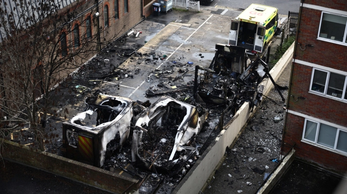 Burnt out ambulances are pictured in a parking area along a street in the Golders Green neighbourhood of north London on March 23, 2026, after the volunteer ambulances run by a Jewish organisation were set on fire overnight. Britain's Prime Minister Keir Starmer on March 23 condemned "a deeply shocking antisemitic arson attack" on volunteer ambulances run by a Jewish organisation in London. (Photo by Henry Nicholls / AFP)