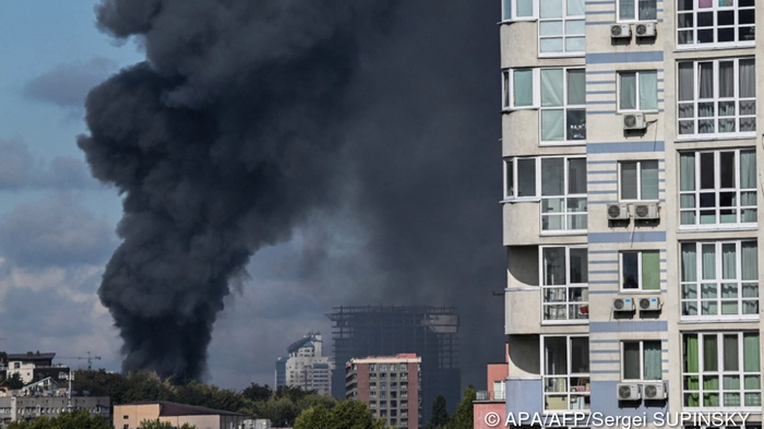 Smoke rises above the city following an air attack in Kyiv on September 23, 2026, amid the Russian invasion of Ukraine. Ukraine on September 23, 2026 accused Russia of increasing its targeting of civilian transport infrastructure after renewed attacks on petrol stations, shipping and railways left at least two dead. (Photo by Sergei SUPINSKY / AFP)