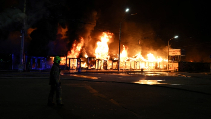 A Ukrainian rescuer works at the site of a Russian strike in Kyiv on August 16, 2026, amid the Russian invasion of Ukraine. Russian strikes killed one person and wounded at least seven others in Ukraine, authorities said August 16, while Moscow officials reported downing more than 100 drones heading towards the capital. (Photo by AFP)