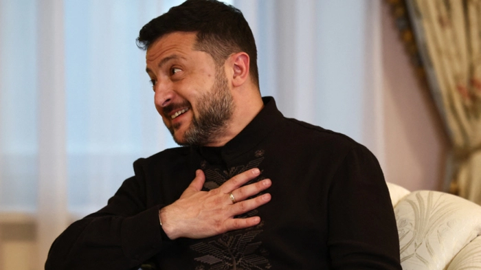 Ukraine's President Volodymyr Zelensky reacts as he speaks with Britain's Prime Minister Andy Burnham (unseen) during their bilateral meeting at Horodetskyi House in Kyiv, on August 24, 2026, during his first trip abroad since taking office. The United Kingdom will keep providing defence aid to Ukraine despite Russia's threats, Prime Minister Andy Burnham said on August 24, 2026 on a visit to Kyiv where allies gathered to discuss support. Air defence supplies are due to be the main priority at the meeting of the Coalition of the Willing, jointly chaired by the leaders of France and Germany, who will participate remotely, and by Britain's Burnham. (Photo by Henry Nicholls / POOL / AFP)