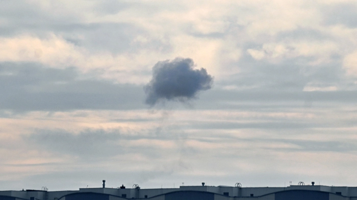 This photograph shows smoke in the sky after Ukrainian air defence fired at Russian drone above Kyiv during a Russian drone strike on the Ukrainian capital on August 30, 2026, amid the Russian invasion of Ukraine. (Photo by Sergei SUPINSKY / AFP)