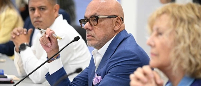 Venezuelan National Assembly President Jorge Rodriguez gestures during a launch of Venezuela's political dialogue process at the Conventions Center in La Carlota neighborhood, Sucre municipality, Caracas on August 6, 2026. US-backed political transition talks between Venezuela's interim government and opposition representatives began on August 6, 2026 in Caracas, an AFP photographer in attendance observed. (Photo by Federico PARRA / AFP)