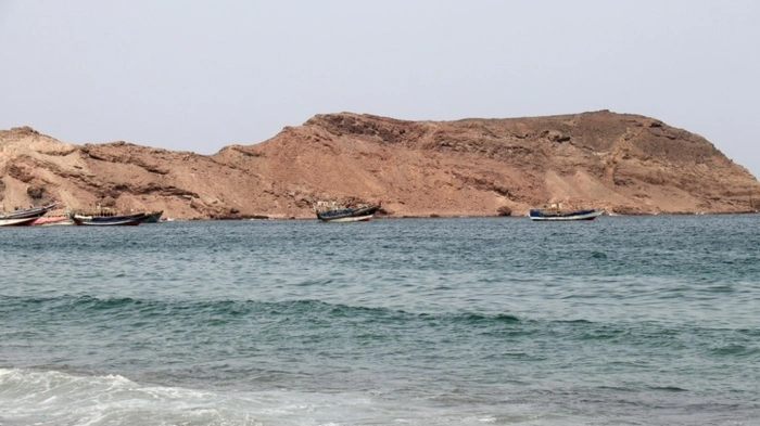 A photo taken from the Yemeni coast southwest of the city of Taiz, shows boats floating at Bab al-Mandab Strait, in the Red Sea, on July 24, 2026. A Houthi spokesman said on July 24, that the rebels were not blocking traffic through the strategic Bab al-Mandeb Strait, after they declared a maritime embargo this week on their foe Saudi Arabia. (Photo by Khaled ZIAD / AFP) /