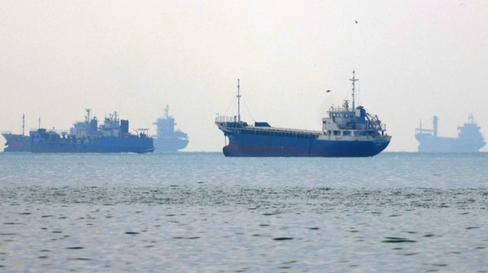 Vessels transit the Hormuz Strait off the coast of Iran's southern port city of Bandar Abbas on September 7, 2026. Iran's top negotiator threatened on September 6 of a more forceful response to any further US attacks after Tehran targeted American warships in their latest round of clashes. The exchanges of fire, which began with US raids last week, come amid a deadlock in the six-month war between the two foes. (Photo by ATTA KENARE / AFP) /