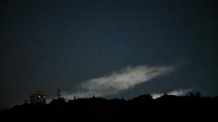 The photograph shows smoke in the sky following Russian ballistic missile strikes over the Ukrainian capital of Kyiv on July 28, 2026, amid the Russian invasion in Ukraine. (Photo by Sergei SUPINSKY / AFP)
