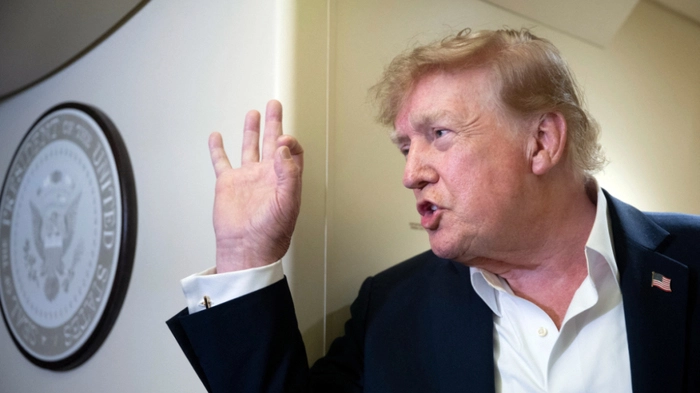 US President Donald Trump speaks to the press aboard Air Force One while flying to Joint Base Andrews, Maryland from Ireland on September 13, 2026. Trump is returning from Ireland where he attended the Irish Open golf tournament at his family's course in Doonbeg over the weekend. (Photo by Brendan Smialowski / AFP)
