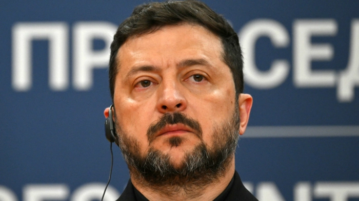 Ukraine's President Volodymyr Zelensky listens during a joint press conference with Serbia's President following their meeting at the Palace of Serbia, in Belgrade on August 8, 2026. (Photo by Andrej ISAKOVIC / AFP)