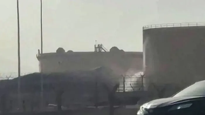 This frame grab taken from AFPTV video footage on September 19, 2026 shows a tank leaking at the scene of a fire at the Aramco fuel depot near King Khalid International Airport in Riyadh. Black smoke and flames rose near Riyadh's international airport on September 19, as a flight tracking website reported cancellations and delays at the hub, hours after Saudi authorities issued an air raid alert. (Photo by AFPTV / AFP) /