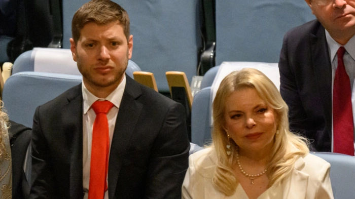 NEW YORK, NEW YORK - SEPTEMBER 26: Yair Netanyahu (L) and Sara Netanyahu listen to Israeli Prime Minister Benjamin Netanyahu speech at The 80th session of The United Nations General Assembly (UNGA) on September 26, 2025 in New York City. This year’s theme for the annual global meeting is:“Better together: 80 years and more for peace, development and human rights.” Alexi J. Rosenfeld/Getty Images/AFP (Photo by Alexi J. Rosenfeld / GETTY IMAGES NORTH AMERICA / Getty Images via AFP)